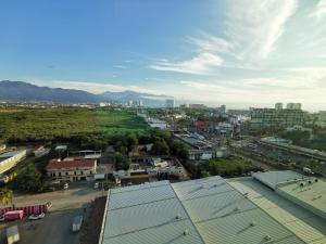 an aerial view of a city with mountains in the background at Holiday Inn & Suites - Puerto Vallarta Marina & Golf, an IHG Hotel in Puerto Vallarta