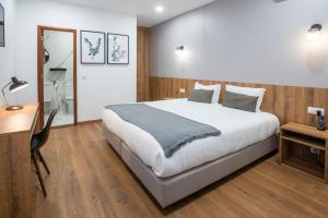 Una cama o camas en una habitación de Hotel Rural Solar das Arcadas