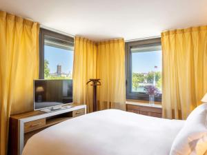 Cama ou camas em um quarto em Sofitel Lyon Bellecour