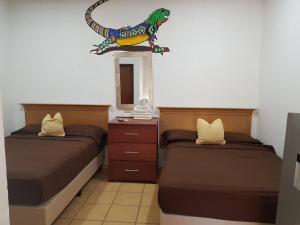 Una cama o camas en una habitación de Hotel Lulu