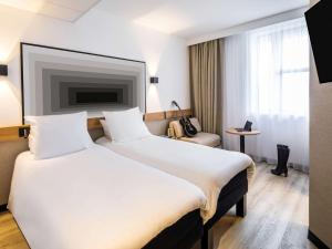 Cama ou camas em um quarto em ibis Brest Centre