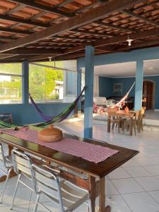 a dining room with a hammock on a table at Pé nas trilhas in Rio de Janeiro