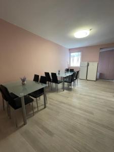 an empty room with tables and chairs in an office at Privatzimmer Hammrich in Neudörfl