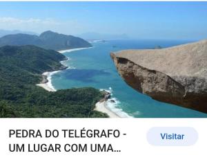 a screenshot of a picture of a beach and the ocean at Pé nas trilhas in Rio de Janeiro