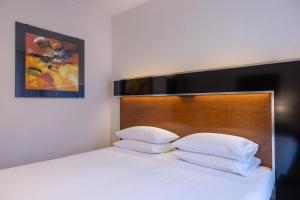 Cama ou camas em um quarto em Grand Majestic Hotel Prague