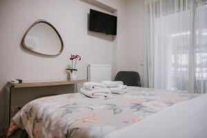 Giường trong phòng chung tại Nafplio Pleasure Stay Ι