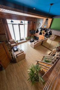 an overhead view of a living room with couches at Evdo Apartments Loft2 Wooden House in Gudauri