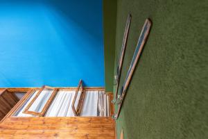 an overhead view of a room with a wooden staircase at Evdo Apartments Loft2 Wooden House in Gudauri