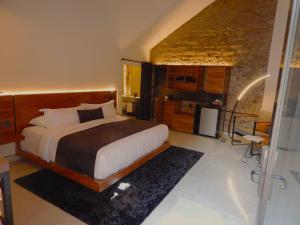 A bed or beds in a room at Hotel Tila