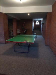 a ping pong table in the middle of a room at WynajemPokoi-StołówkaGerlachscŁętowskiWłŁętowskaM ŁętowskaL Łętowska-HyłaB in Białka Tatrzanska