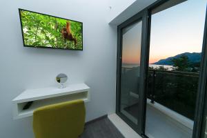 A television and/or entertainment centre at Apartments Villa Nadalina Deluxe