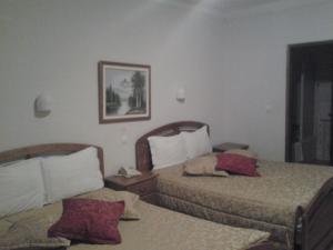 A bed or beds in a room at Residencial Pinto