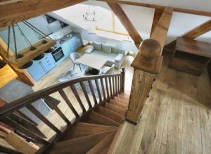 an overhead view of a living room and kitchen with a staircase at Nora Berry in Nida