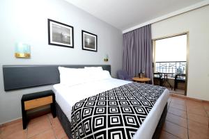 Comfort Hotel Eilat में एक कमरे में एक या कई बेड