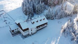 an aerial view of a house covered in snow at Apartmán Ela in Horní Blatná