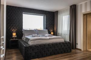 Cama ou camas em um quarto em Hotel Demanova Apartments - Dependance