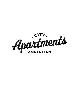 un panneau indiquant la superétoile des appartements de ville dans l'établissement City Apartments Amstetten, à Amstetten