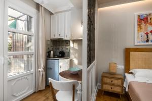 A kitchen or kitchenette at Well Apartments by Skyloft Corfu