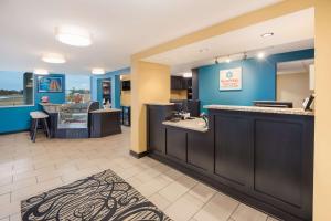 a waiting area in a dental office with blue walls at SureStay Plus Hotel by Best Western Jasper in Jasper