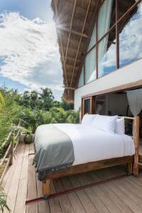 Кровать или кровати в номере La Valise Tulum, member of Small Luxury Hotels