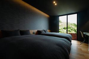 A bed or beds in a room at Awaji-shima C-Side Marine Terrace - Vacation STAY 88860v