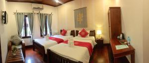 Luang Prabang Pangkham Lodge में एक कमरे में एक या कई बेड