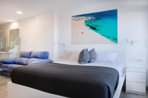 Gulta vai gultas numurā naktsmītnē Coccoloba Suites Corralejo