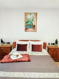 a bedroom with a bed with a towel on it at Apartament Cetate in Alba Iulia