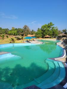 Poolen vid eller i närheten av The Dandelion - Colonels Jungle Resort