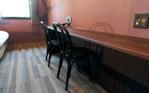 two chairs sitting at a bar in a hotel room at Rakuten STAY Kokura Station Standard Twin Room with counter table in Kitakyushu