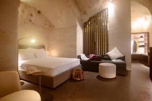 Ліжко або ліжка в номері Le Malve Cave Retreat