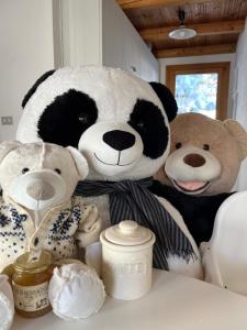 a group of stuffed animals sitting on a table at Chalet Blanc "Le Flocon" in Courmayeur