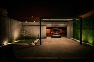 a truck parked in a garage at night at Spa Lux Apatin in Apatin