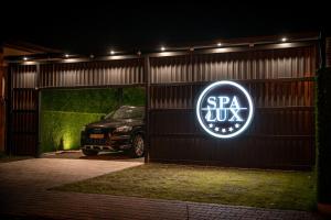 a car is parked in a garage at night at Spa Lux Apatin in Apatin