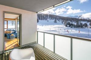 a balcony with a view of a ski resort at Terrazza su Sestriere Lux in Sestriere