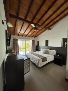 A bed or beds in a room at Serenity Suites Casa Boutique