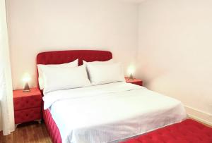 a bedroom with a white bed with two night stands at La Casa - comfortable - by PA in Luzern