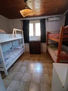 Ένα ή περισσότερα κρεβάτια σε δωμάτιο στο Cataratas Jazz Hostel