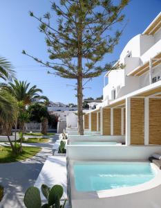 a villa with a swimming pool and a resort at Daedalus Hotel in Fira