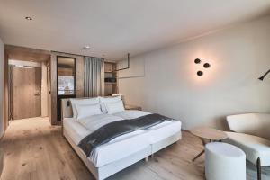 A bed or beds in a room at AMA Stay