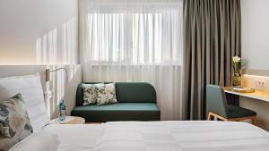 Hey Lou Hotel Karlsruhe Messe房間的床