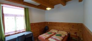 Cama ou camas em um quarto em Ferienwohnung für 5 Personen Rezidence KIENBERG Lipno nad Vltavou