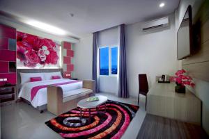 Кровать или кровати в номере favehotel Langko Mataram - Lombok