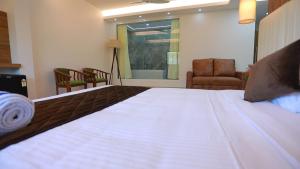 Cama ou camas em um quarto em Alleppey Haven Beach Villa