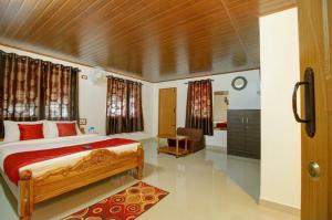 Postelja oz. postelje v sobi nastanitve Hill View Homestay Madikeri Coorg 3BHK Villa