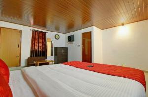 Postelja oz. postelje v sobi nastanitve Hill View Homestay Madikeri Coorg 3BHK Villa