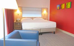 Cama ou camas em um quarto em Park Inn by Radisson Linz