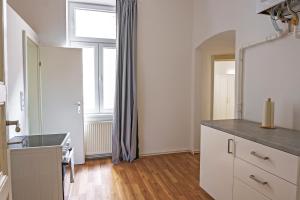 a kitchen with a sink and a window in it at Vienna City Apartments 1090 Vienna in Vienna