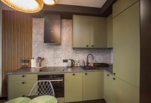 Dapur atau dapur kecil di Cudowny apartament blisko dworca