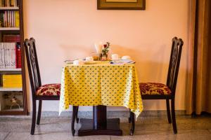 a table with a yellow polka dot table cloth at Rawla Rawatsar in Jaipur